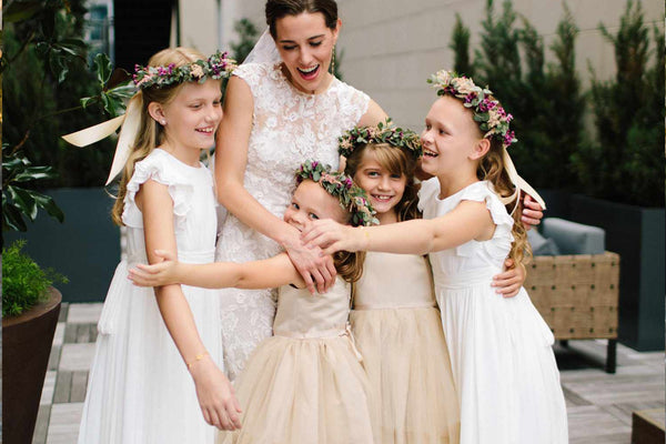 do flower girl dresses have to match,  does flower girl dress have to match bride,  flower girl dress color etiquette,  how old should a flower girl be,