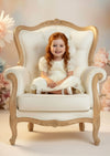 Ivory knee‑length flower girl dress with embroidered lace bodice and puff sleeves
