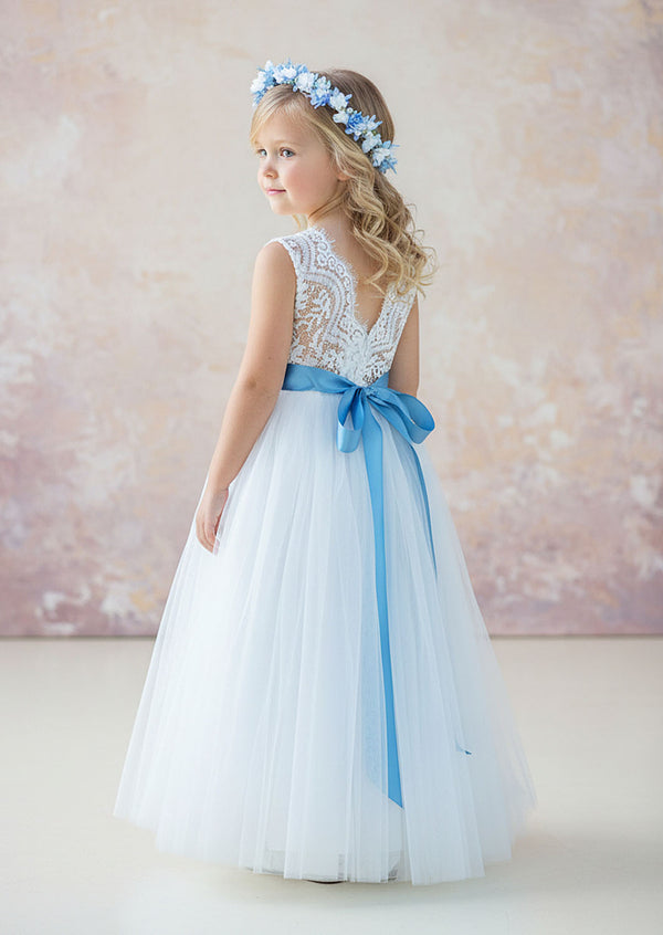 sleeveless white boho flower girl dress combines a delicate lace bodice with a flowing tulle skirt, creating a dreamy and elegant style perfect for rustic flower girls.