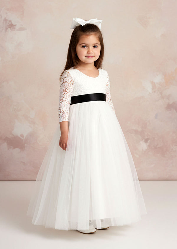 This enchanting white flower girl dress features a dreamy long-sleeve lace bodice with delicate feathering along the back V-neckline, with a billowing tulle skirt & custom Sash
