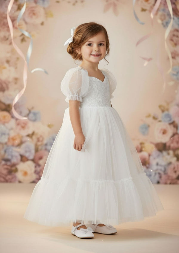 Vintage‑inspired white baptism dress featuring lace and soft tulle
