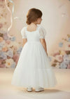 White knee‑length special occasion dress with puff sleeves and lace bodice
