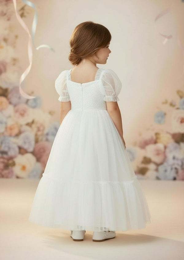 White knee‑length special occasion dress with puff sleeves and lace bodice