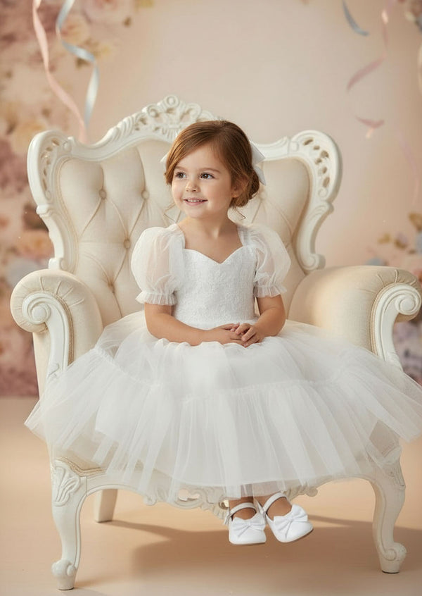 White lace flower girl dress with embroidered bodice and puff sleeves