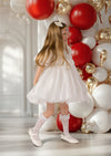 Elegant girls’ winter dress in white with pearl details, perfect for Christmas photos