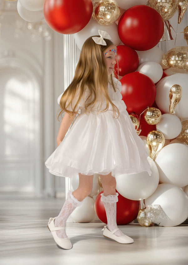 Elegant girls’ winter dress in white with pearl details, perfect for Christmas photos