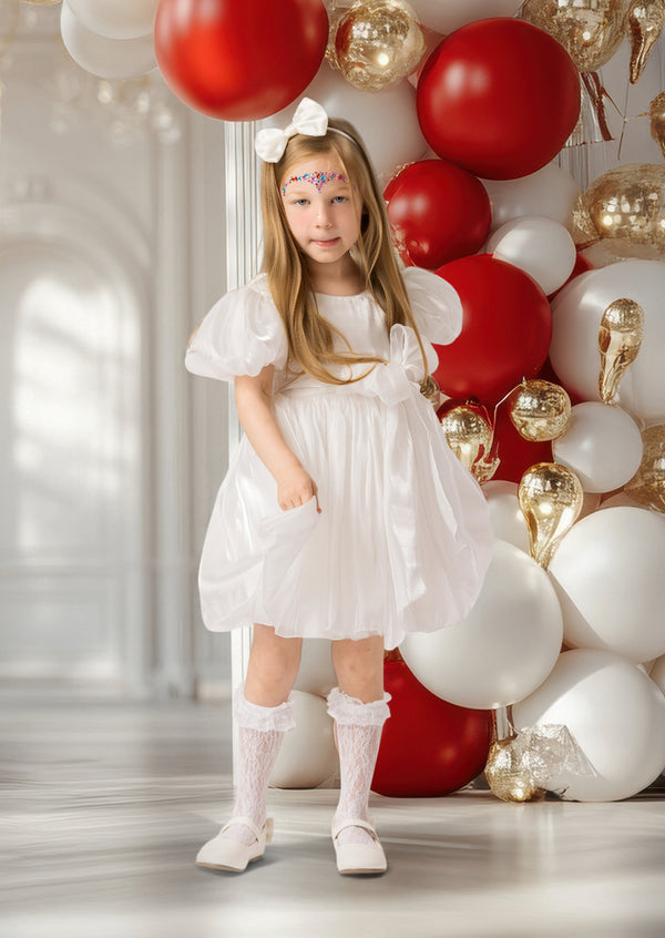 Elegant girls’ winter dress in white with pearl details, perfect for Christmas photos