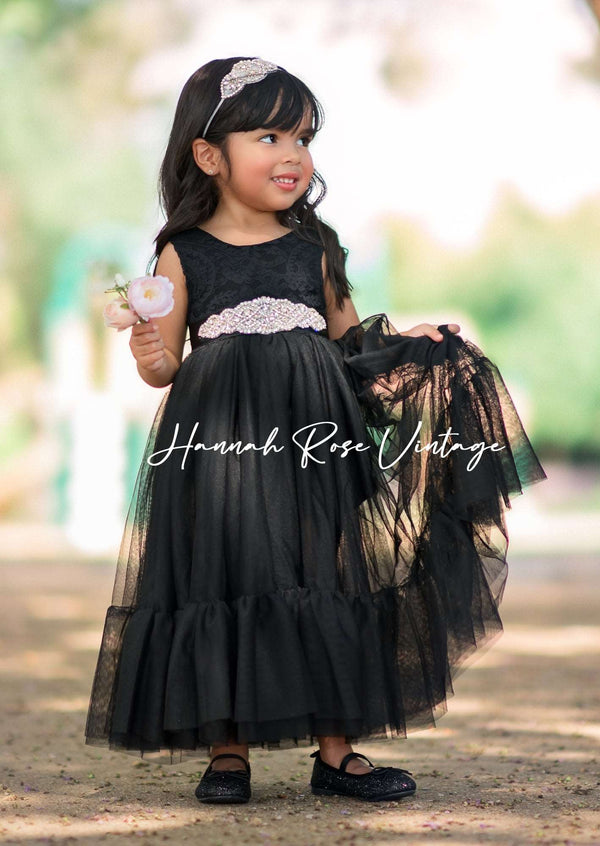 girl wearing black tulle flower girl dress