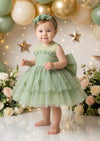 baby girl 1st birthday dress in avocado green standing