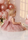 Baby Girl Pink Birthday Party dress with illusion neckline and applique flowers side view