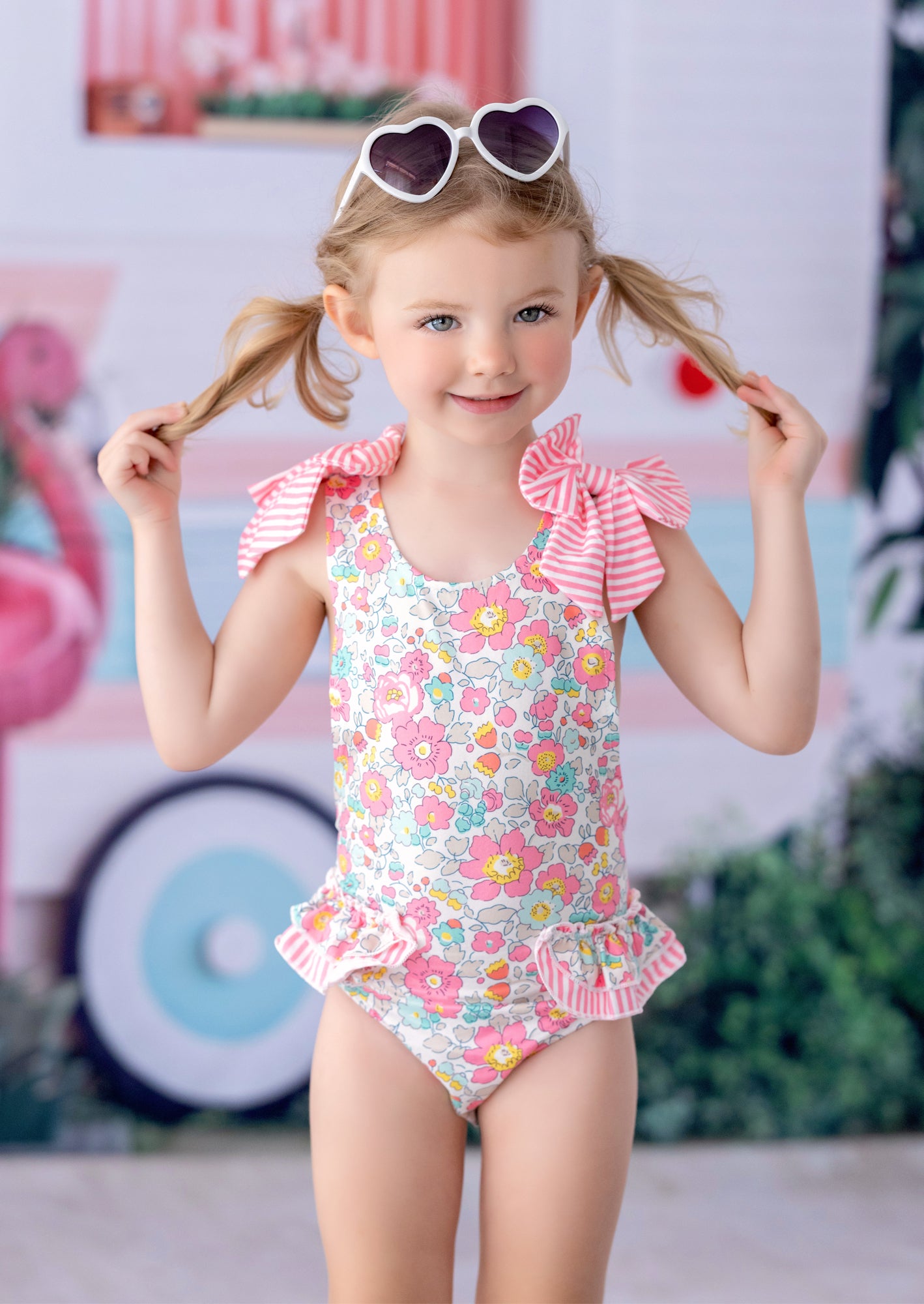 Girls’ Baby Toddler & Girls Pink floral swimsuit with pink forget‑me‑nots, bows, and cross‑back straps