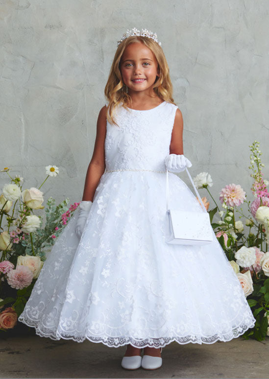 a white lace dream that's ready to steal the spotlight! This enchanting dress boasts intricate lace detailing paired with a whimsical scalloped hemline. 