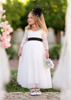 White tulle and lace flower girl dress with black sash for black and white wedding themes