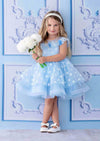 Blue dot birthday party dress with layered organza, bow back, and flower trim for special occasions