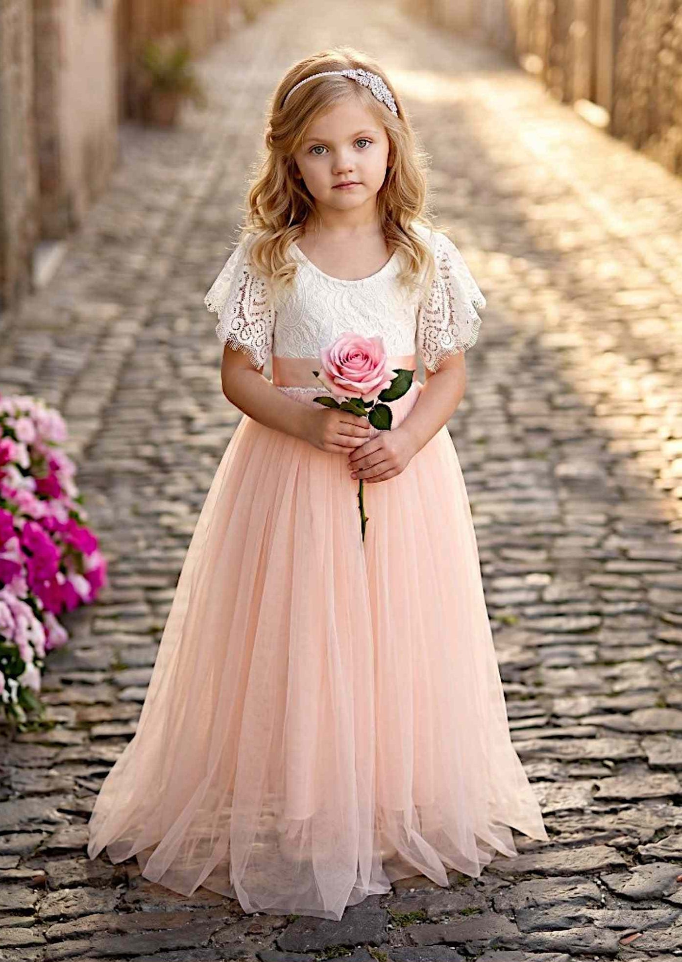 Flutter Sleeve blush pink flower girl dress with lace bodice, flutter sleeves, and tulle skirt