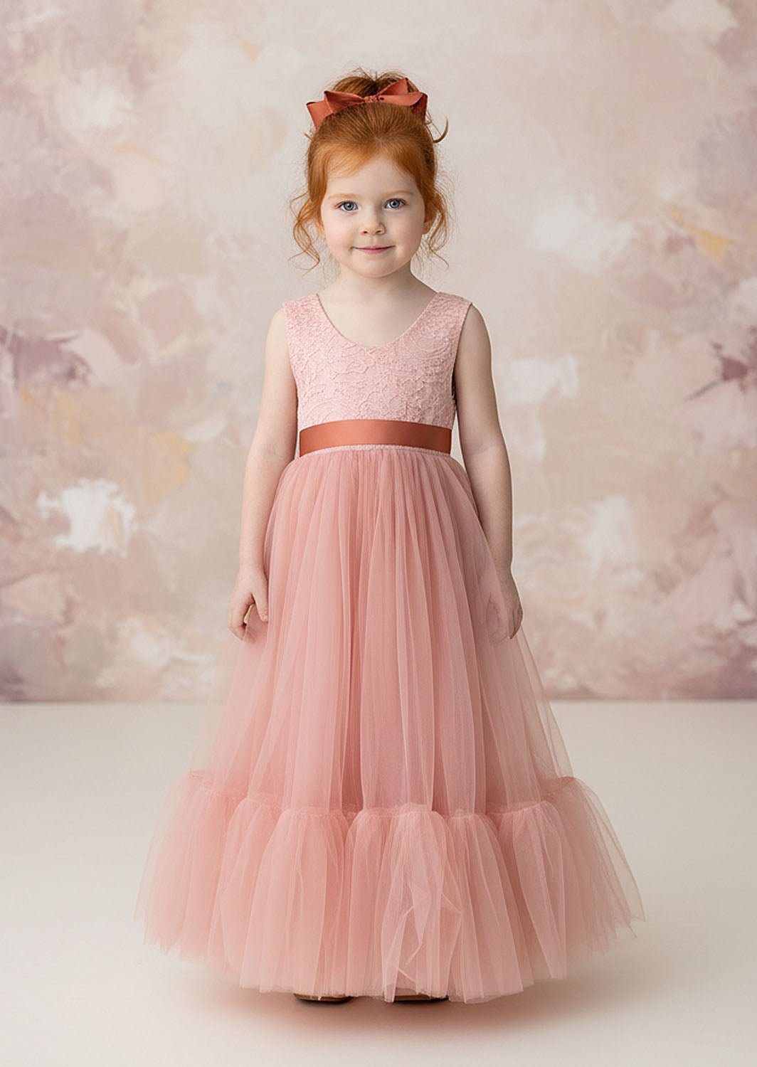 sleeveless coral flower girl dress with ruffle hem