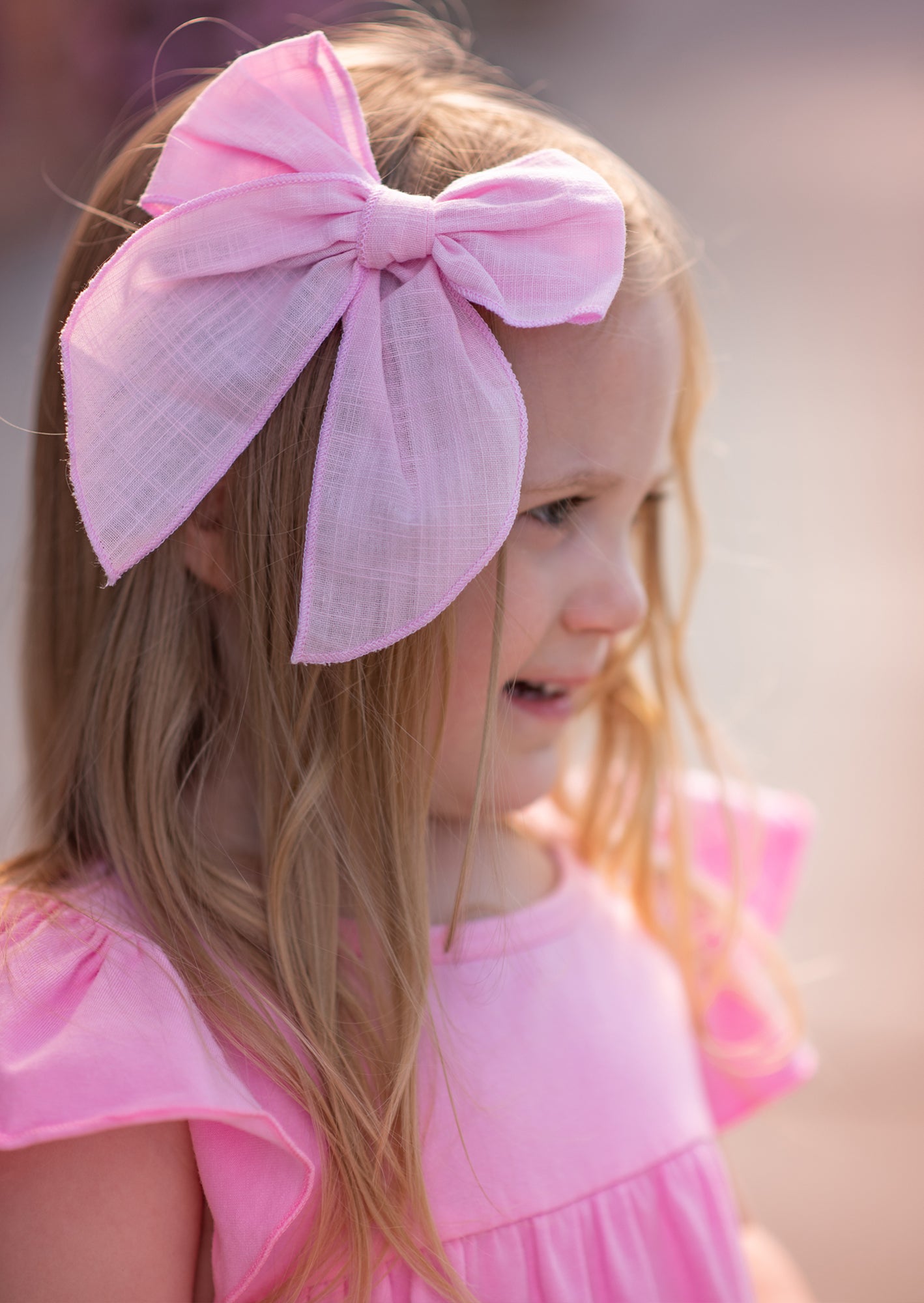 girls wearing candy pink fable bow