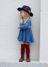 girls in blue twirl dress wearing western hat
