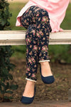Child wearing navy floral leggings with lace trim and elastic waistband sitting on a bench outdoors