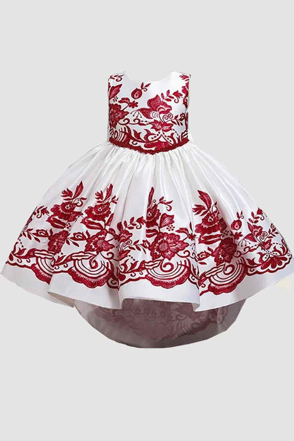 White satiny party dress with red floral flocked design on bodice and hemline