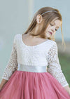 Flower girl dress with white lace top and pink skirt featuring a satin ribbon sash belt